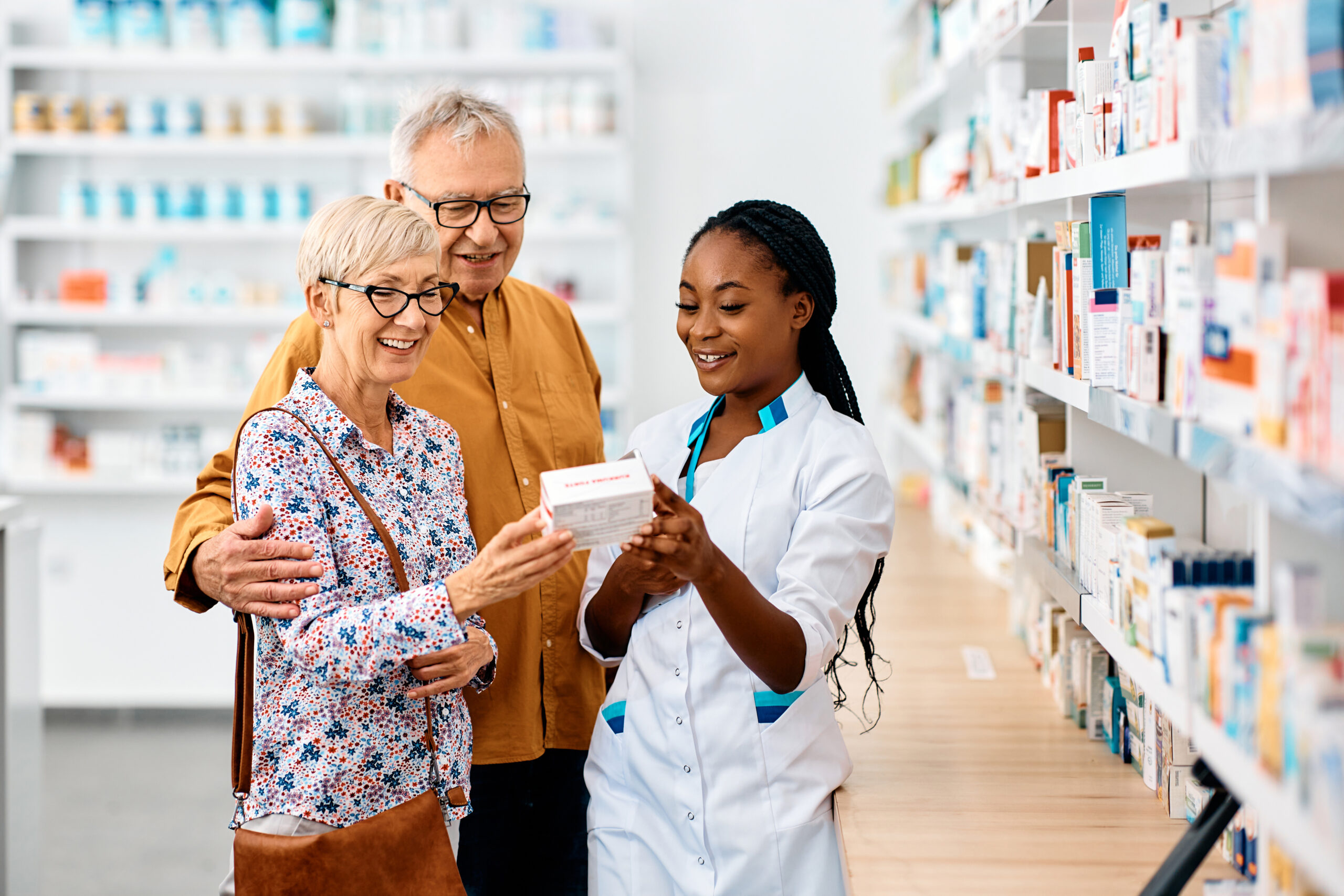 Image of a pharmacist talking with patients