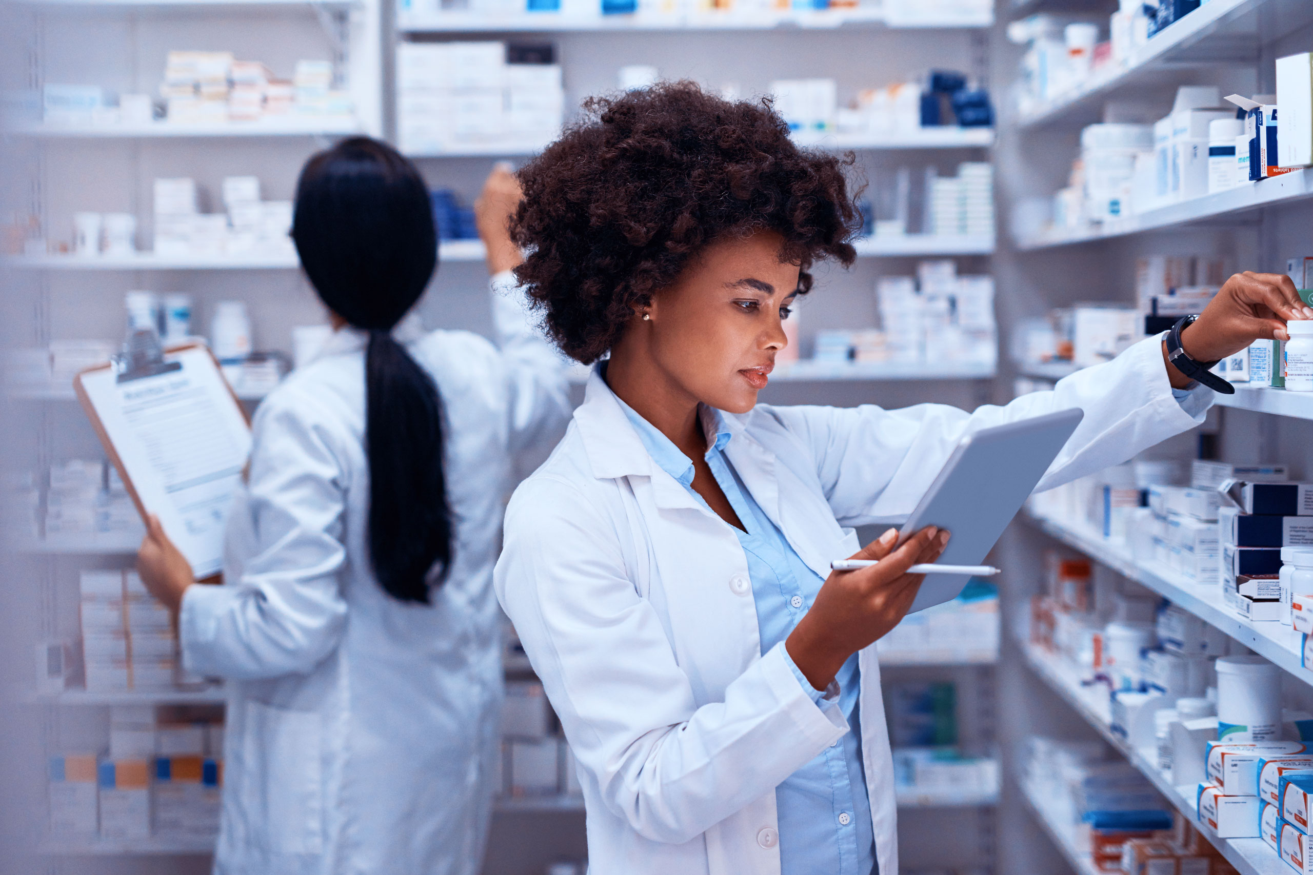 Female Pharmacist looking at iPad