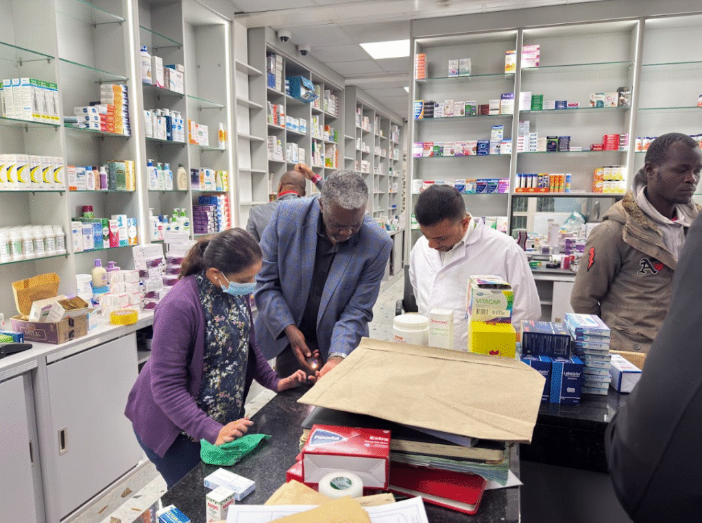 Pharmacists inspecting drugs